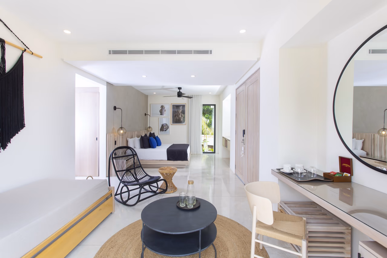 Nantipa Nanku Suite living area with daybeds and tropical garden view, Santa Teresa